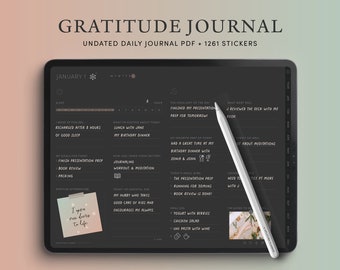 May include: A black digital tablet with a white stylus pen on the screen. The screen displays a digital gratitude journal with a daily planner and a section for listing things you are grateful for. The journal is dated January 1st. The text "GRATITUDE JOURNAL" is at the top of the screen.