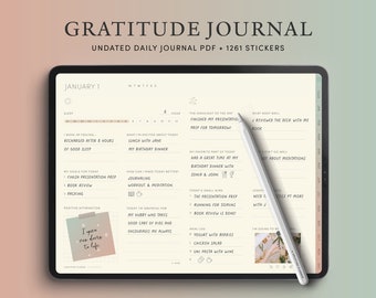 May include: A digital tablet displaying a daily gratitude journal template with a grey stylus. The journal is titled "Gratitude Journal" and features a daily planner with sections for sleep, goals, what you are grateful for, the highlight of the day, what went well, and a meal log. The journal is dated January 1.