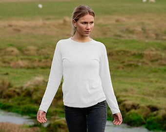 May include: A white long-sleeved shirt with a crew neck. The shirt is made of a soft, comfortable fabric and is perfect for everyday wear.