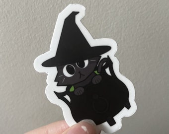 Cute Black Witchy Cat Sitting in a cauldron Vinyl Sticker