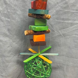 Large Ball and popsicle stick bird toy