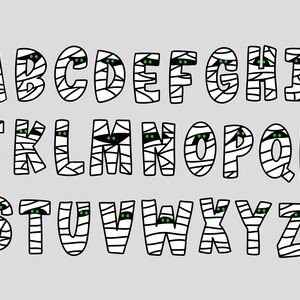 K&ouml;nnte beinhalten: Ein Alphabet aus Mumienbuchstaben mit gr&uuml;nen Augen. Jeder Buchstabe ist wei&szlig; mit schwarzen Umrissen und einem Mumienbandagenmuster.