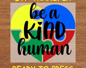 May include: A heart-shaped jigsaw puzzle piece design with the words "be a kind human" in black text. The jigsaw pieces are yellow, blue, green, and red. The design is ready to press.