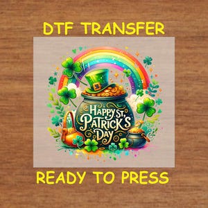 May include: A colorful graphic for St. Patrick's Day, featuring a pot of gold, a rainbow, and shamrocks. The text "Happy St. Patrick's Day" is prominently displayed. The words "DTF TRANSFER" and "READY TO PRESS" are also visible.