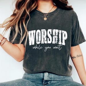 May include: A rustic wooden sign with the text "Welcome to our porch" in white lettering. The sign features a distressed finish and a simple, inviting design, perfect for outdoor decor.