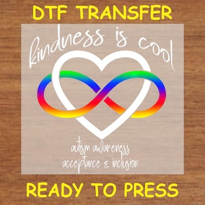 May include: A white heart with a rainbow infinity symbol inside. The text "kindness is cool" is above the heart and the text "autism awareness acceptance & inclusion" is below the heart. The text "DTF TRANSFER READY TO PRESS" is at the top and bottom of the image.