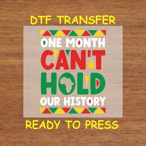 May include: A green, red, and yellow iron-on transfer design with the text "One Month Can't Hold Our History" and a silhouette of the continent of Africa. The design is ready to press.