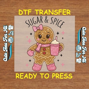 May include: A DTF transfer featuring a gingerbread person with a pink scarf, mittens, and boots, holding a pink glittery cup with whipped cream. The text "Sugar & Spice" and "Ready to Press" are included.