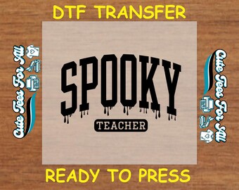 May include: A DTF transfer with the word "SPOOKY" in large black letters with dripping effects, above the word "TEACHER". The words "DTF TRANSFER" and "READY TO PRESS" are in yellow. The phrase "Cute Tees For All" is on the sides.