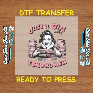 May include: A pink and white graphic design with a woman reading a book. The text reads "Just a Girl with a TBR Problem".