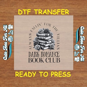 May include: A black and white design on a beige background with the text "Always Fallin' for the Villian Dark Romance Book Club" and a stack of books with roses around them. The text "Ready to Press" is below the design.