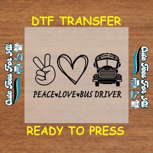 May include: A DTF transfer design featuring a peace sign, a heart, and a school bus illustration in black. The text includes "PEACE LOVE BUS DRIVER" and "READY TO PRESS". The design is on a light brown background.