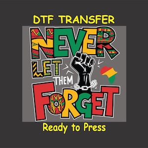 May include: A colorful graphic design with the text "Never Let Them Forget" in bold, red, yellow, and green letters. A raised fist with a chain is in the center of the design. The text "DTF Transfer" is at the top of the design and "Ready to Press" is at the bottom.