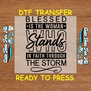 May include: A DTF (Direct to Film) transfer with the text "BLESSED IS THE WOMAN WHO STANDS IN FAITH THROUGH THE STORM." The design is in black, with yellow text at the top and bottom. The words "Ready to Press" are also included.