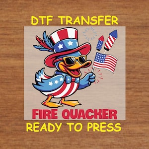 May include: A patriotic cartoon duck wearing sunglasses, a red, white, and blue Uncle Sam hat, and a bow tie. The duck is holding an American flag and fireworks. Text on the image reads "DTF TRANSFER", "FIRE QUACKER", and "READY TO PRESS".