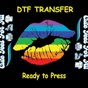 May include: Black graphic with a rainbow-colored kiss print. The text "DTF TRANSFER" is at the top, and "Ready to Press" is at the bottom. The words "Cute Tees For All" are on the sides.