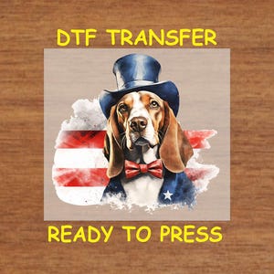May include: A digital transfer design featuring a cartoon basset hound wearing a top hat and bow tie, with a red, white, and blue watercolor background. The design says "DTF Transfer" and "Ready to Press".