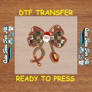 May include: DTF transfer design featuring a Christmas bow with a Santa Claus face and a stethoscope. The bow is patterned with red, green, and brown plaid. The text "DTF TRANSFER" and "READY TO PRESS" are displayed in yellow.