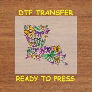 May include: A DTF transfer sheet with a design of a state outline filled with colorful bows. The sheet is ready to press.  DTF Transfer, Ready to Press.