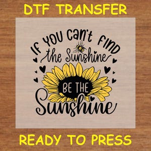 May include: Ready to press iron-on transfer with a sunflower and a bee, and the text "If you can't find the sunshine, be the sunshine".