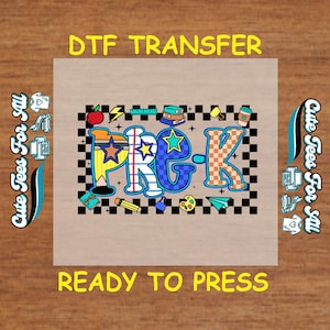 May include: A colorful DTF transfer design for preschool, featuring the text "Pre-K" in a playful font with stars and school-themed illustrations. The design includes a red apple, books, and a coffee cup. The words "DTF TRANSFER" and "READY TO PRESS" are also included.
