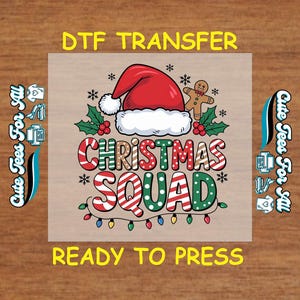 May include: A DTF transfer design featuring a Santa hat, gingerbread man, holly, and the words "Christmas Squad." The design includes colorful text and string lights, perfect for holiday apparel.