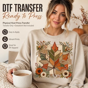 May include: A beige sweatshirt featuring a large, central graphic of a patchwork-style maple leaf in shades of orange, green, and brown, surrounded by autumn flowers. Text reads: DTF TRANSFER Ready to Press, Physical Heat Press Transfer, Transfer Only, Sweatshirt Not Included, Easy to Apply, Vibrant Prints, Great for DIY Apparel.