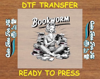 May include: A black and white illustration of a woman sitting on a stack of books. She is holding a book in her hands and has a surprised expression on her face. The text "Bookworm" is above her head. The image is ready to be pressed onto a t-shirt.