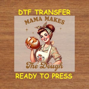 May include: A digital transfer design featuring a cartoon woman holding a loaf of bread with the text "Mama Makes The Dough" and "Ready To Press".