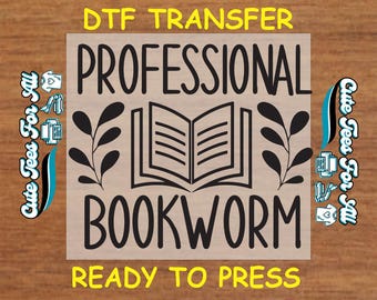 May include: A black and white design for a DTF transfer, featuring the text "Professional Bookworm" with an open book and leafy branches. The text "Ready to Press" is also included.