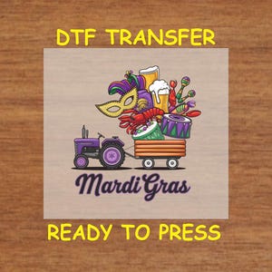 May include: A purple tractor pulling a wagon filled with Mardi Gras themed items, including a mask, beads, a beer mug, and a drum. The text "Mardi Gras" is written below the wagon. The text "DTF Transfer Ready to Press" is written above and below the image.