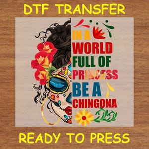 DTF transfer design featuring a half sugar skull with roses and bold text reading "In a World Full of Princesses, Be a Chingona" in vibrant colors.