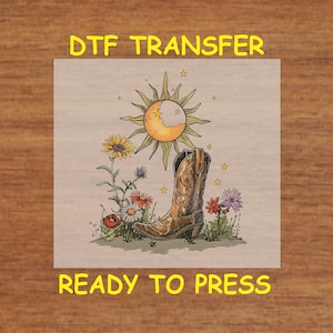 May include: A digital transfer design featuring a brown cowboy boot with a yellow sun and moon, surrounded by colorful flowers. The design is ready to press.
