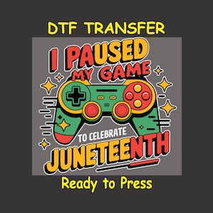 May include: A colorful graphic design for a t-shirt featuring a video game controller with the text "I Paused My Game To Celebrate Juneteenth".