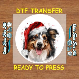 May include: A DTF transfer featuring a smiling dog wearing a Santa hat, set against a white circle. The dog has black, brown, and white fur. The text "DTF TRANSFER" and "READY TO PRESS" are in yellow.