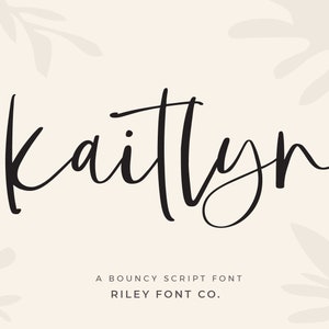 May include: A digital graphic featuring the name "Kaitlyn" in a flowing, black script font. The text is set against a soft beige background with subtle leaf-like illustrations. Below, it reads "A Bouncy Script Font" and "Riley Font Co."