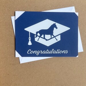 Equestrian graduation card with white cap/lettering