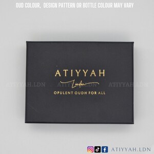 May include: A black box with gold lettering that reads "ATIYYAH London" and "OPULENT OUDH FOR ALL".