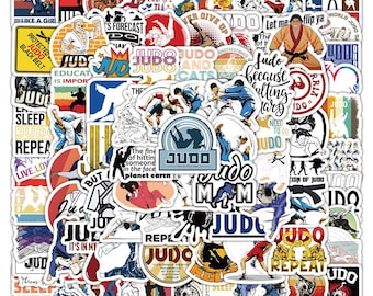May include: A collection of colorful stickers featuring the word "Judo" in various fonts and designs. The stickers feature images of judo practitioners, quotes about judo, and other judo-related imagery.