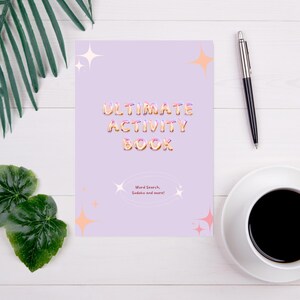 May include: A purple activity book with the text "ULTIMATE ACTIVITY BOOK" in a colorful, bubbly font. The book features word searches, Sudoku puzzles, and more.
