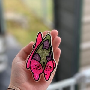 May include: A white ceramic mug with a black handle and the text "But First, Coffee" in a bold, black font. The mug is set against a neutral background, highlighting its simple design.