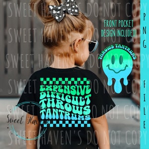 May include: Black t-shirt with a green and blue checkered pattern and the text "Expensive Difficult Throws Tantrums" in a retro font.