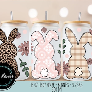 May include: Three 16 ounce stainless steel tumblers with a white background and different bunny designs. The designs include a leopard print bunny, a pink and white floral bunny, and a plaid bunny. The tumblers are labeled "16 oz Libby Wrap - Bunnies - 9.75x5 300 DPI".