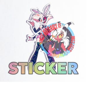 May include: A die-cut sticker featuring a white rabbit-like character with pink accents and a red-skinned character with white hair, both in an animated style. The word STICKER is printed in large, rainbow-gradient block letters at the bottom.