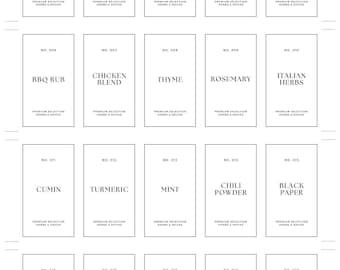May include: A set of twenty rectangular spice labels with black text on a white background. The labels include names like "Salt," "Black Paper," "Paprika," and "Basil." The labels are for herbs and spices.