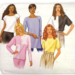 May include: A Butterick sewing pattern envelope showing illustrations of women's tops. The designs include a white raglan sleeve top, a light blue tunic, a color-blocked black and white tee, a pink and white color-blocked top, and a yellow tee. The pattern number is 3030.