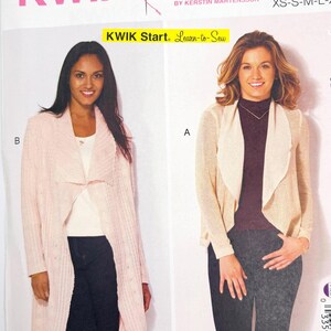 May include: Kwik Sew pattern K4192 for misses' sizes XS-S-M-L-XL. The envelope features two views: view B shows a long, light pink ribbed cardigan, and view A shows a shorter, cream-coloured cardigan with a draped collar. Includes Kwik Start branding.