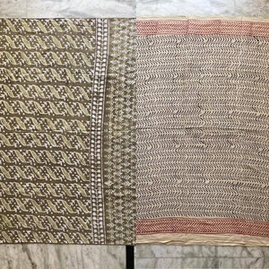 May include: Two fabric panels with different patterns. One panel is olive green with a white and light green repeating design. The other panel is off-white with a black wavy pattern and a red border. The fabric is likely cotton or linen.
