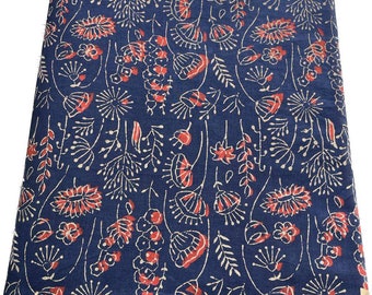 May include: Blue fabric with a white and red floral pattern. The fabric has a hand-printed look and is perfect for quilting, crafts, or home decor.
