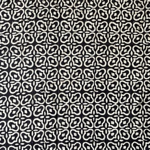 May include: Black and white fabric with a repeating pattern of stylized floral shapes.